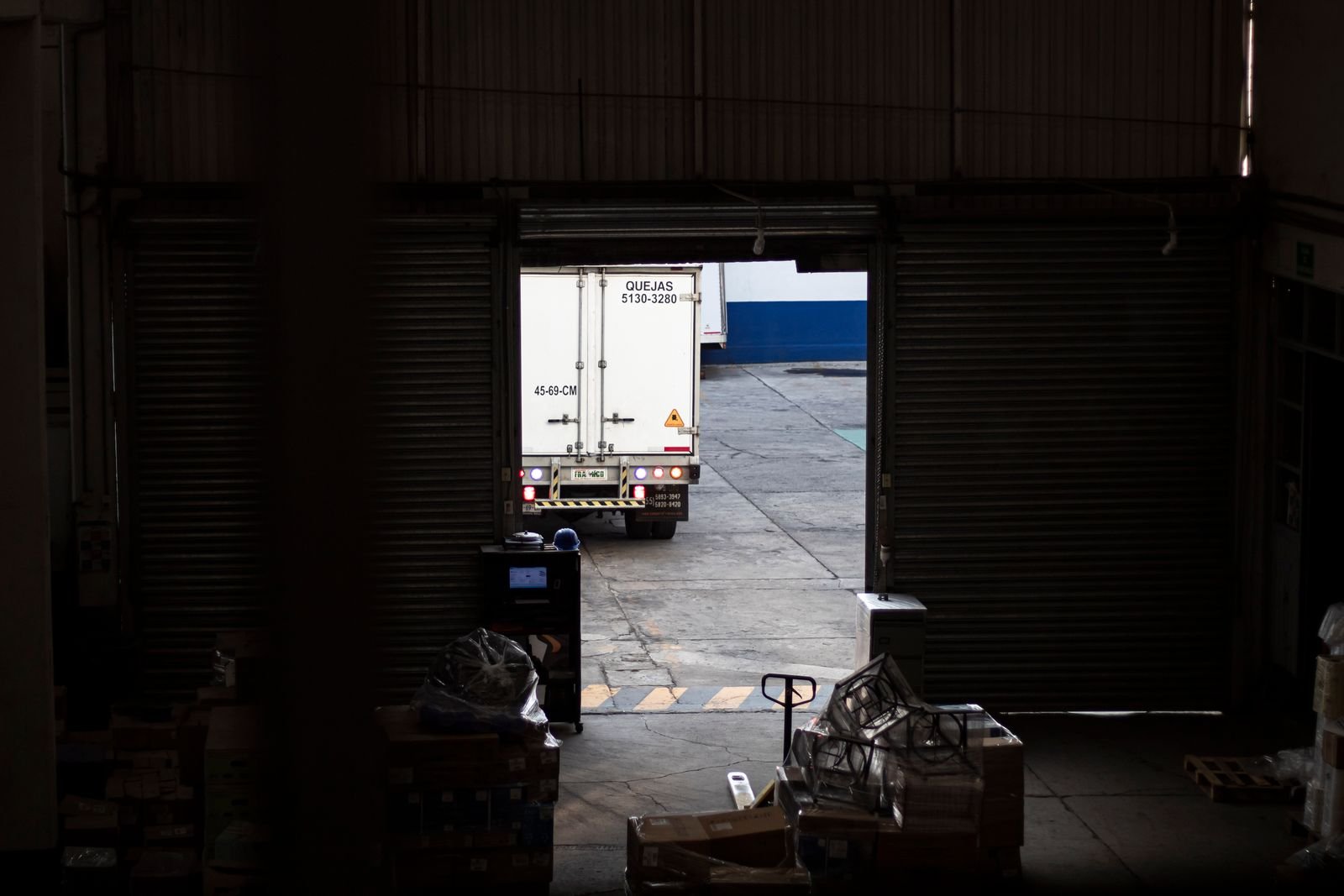 A truck at a loading dock exit checkpoint.